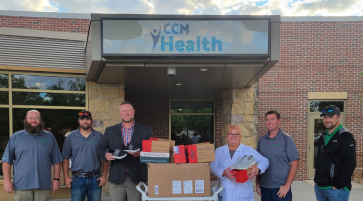Article image:  Chippewa County Corn and Soybean Growers Shoe Donation to CCM Health.
